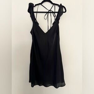 Free People silky slip dress with metal detail and ties in the back. Size L.